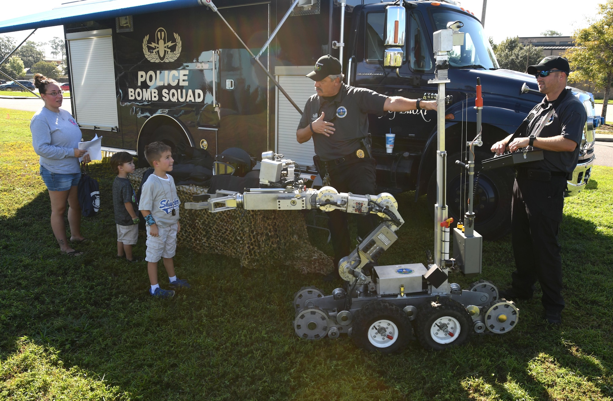 Lt. Milton Houseman, Biloxi Police Department Bomb Squad commander, talks about the capabilities of an F6A andros police robot to Keesler families during Operation Hero Oct. 14, 2017, on Keesler Air Force Base, Mississippi. The event was designed to help children better understand what their parents do when they deploy. (U.S. Air Force photo by Kemberly Groue)