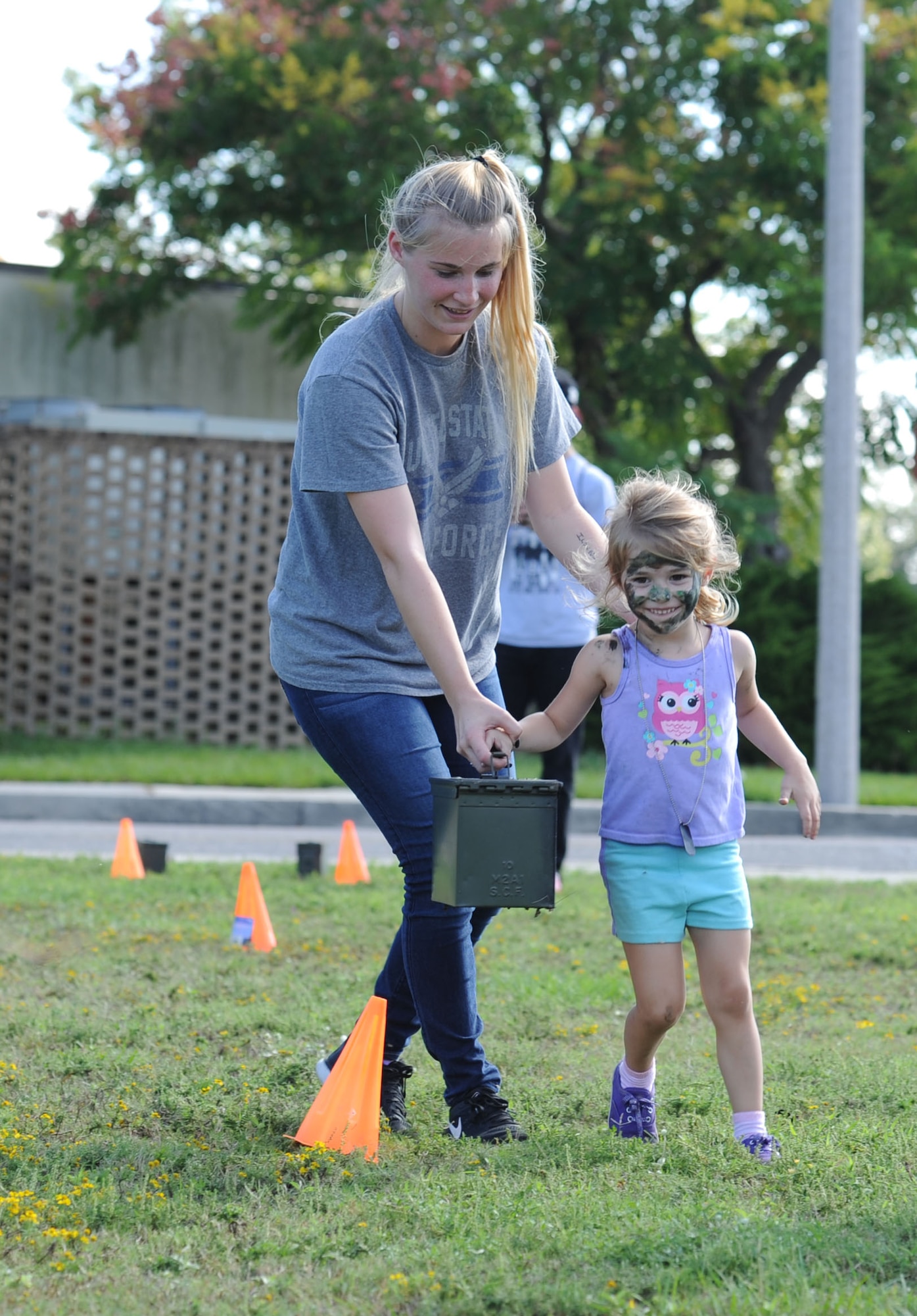 Nicole and Paisley Hoose, complete  the Keesler Marine Detachment obstacle course during Operation Hero Oct. 14, 2017, on Keesler Air Force Base, Mississippi. The event was designed to help children better understand what their parents do when they deploy. (U.S. Air Force photo by Kemberly Groue)