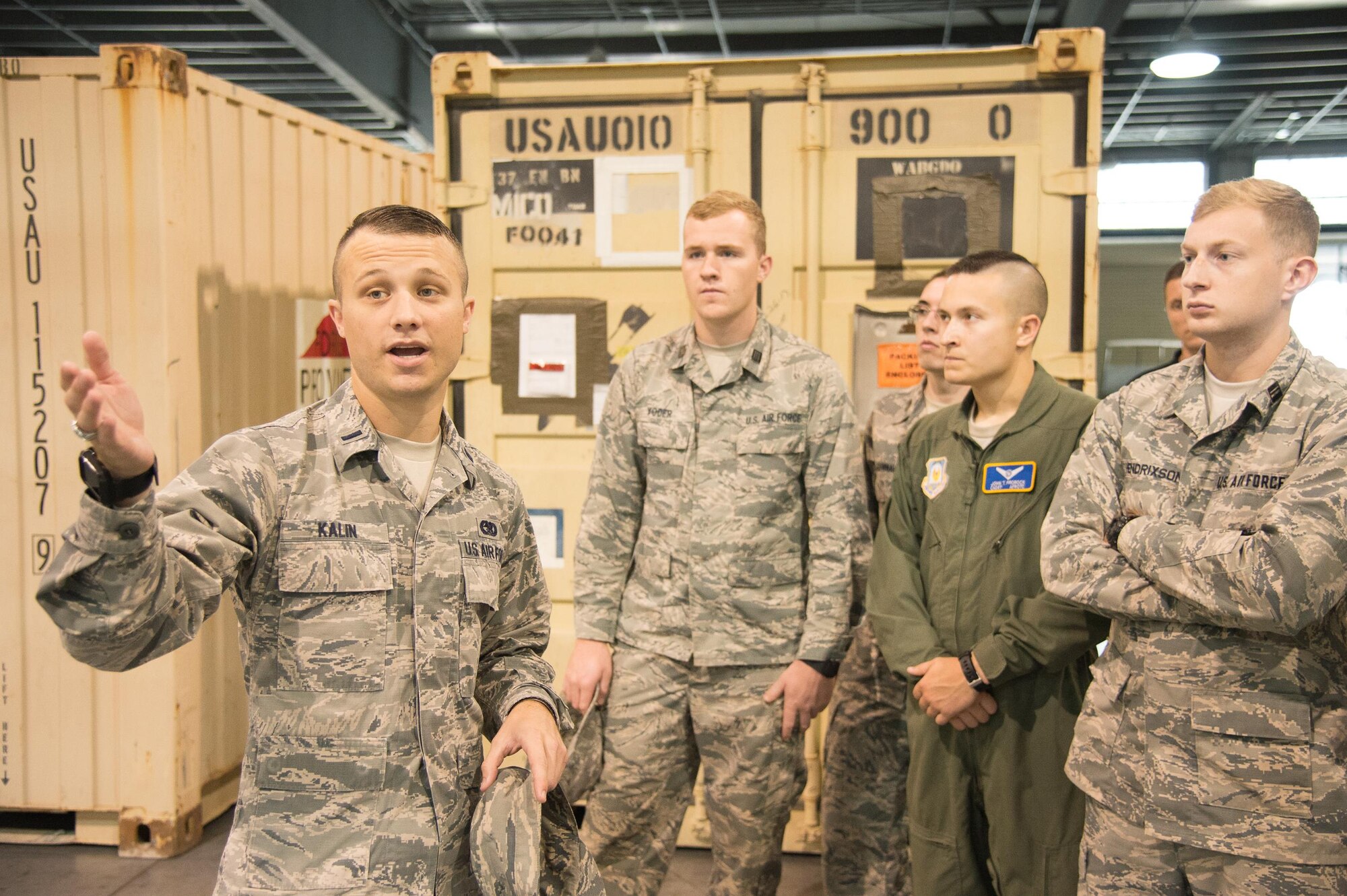 1st Lt. Hunter Kalin, 436th Aerial Port Squadron Air Terminal Operations Center flight commander, gives ROTC cadets a tour of the Super Port Oct. 11, 2017, at Dover Air Force Base, Del. Cadets from several colleges visited the base to get a closer look at the various occupational specialties offered by the Air Force. (U.S. Air Force photo by Mauricio Campino)
