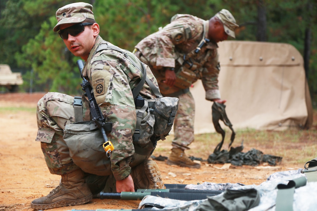 A soldier lifts a litter during the Expert Field Medical Badge exhibition.