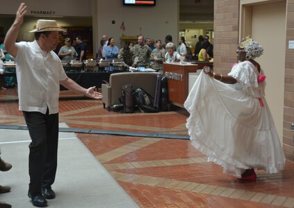 Lee Perez and Alcira Etienne dance a traditional Spanish dance Oct. 5 at the Hispanic Heritage observance in the Brooke Army Medical Center Medical Mall.
