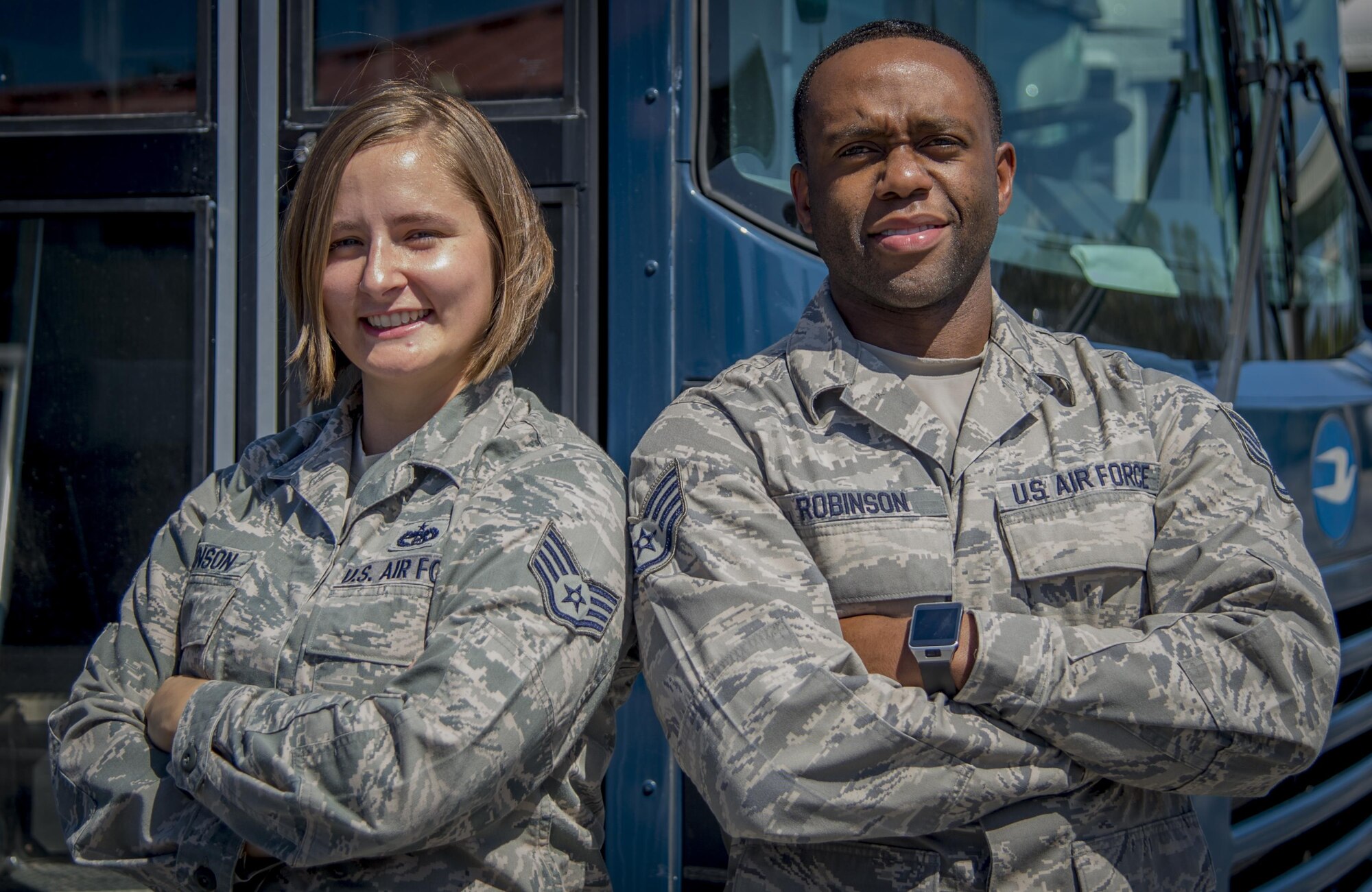 U.S. Air Force Staff Sgt. Christine Robinson, a unit deployment manager, and Staff Sgt. Kevin Robinson, a vehicle dispatcher, both assigned to the 6th Logistics Readiness Squadron, pause for a photo at MacDill Air Force Base, Fla., Oct. 12, 2017. The married couple has completed four deployments between the two of them, totaling 28 months, and are now scheduled to serve their first deployment together. (U.S. Air Force photo by Senior Airman Mariette Adams)