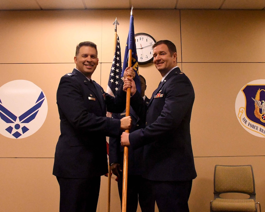 Maj. Joseph Thomas, right, assumes command of the 94th Civil Engineer Squadron from Col. Marty Hughes, 94th Mission Support Group commander, during a ceremony at Dobbins Air Reserve Base, Georgia on Oct. 15, 2017. Thomas said he hopes earn the new title in the eyes of the Airmen he is charged to lead every day. (U.S. Air Force photo by Staff Sgt. Jaimi L. Upthegrove)