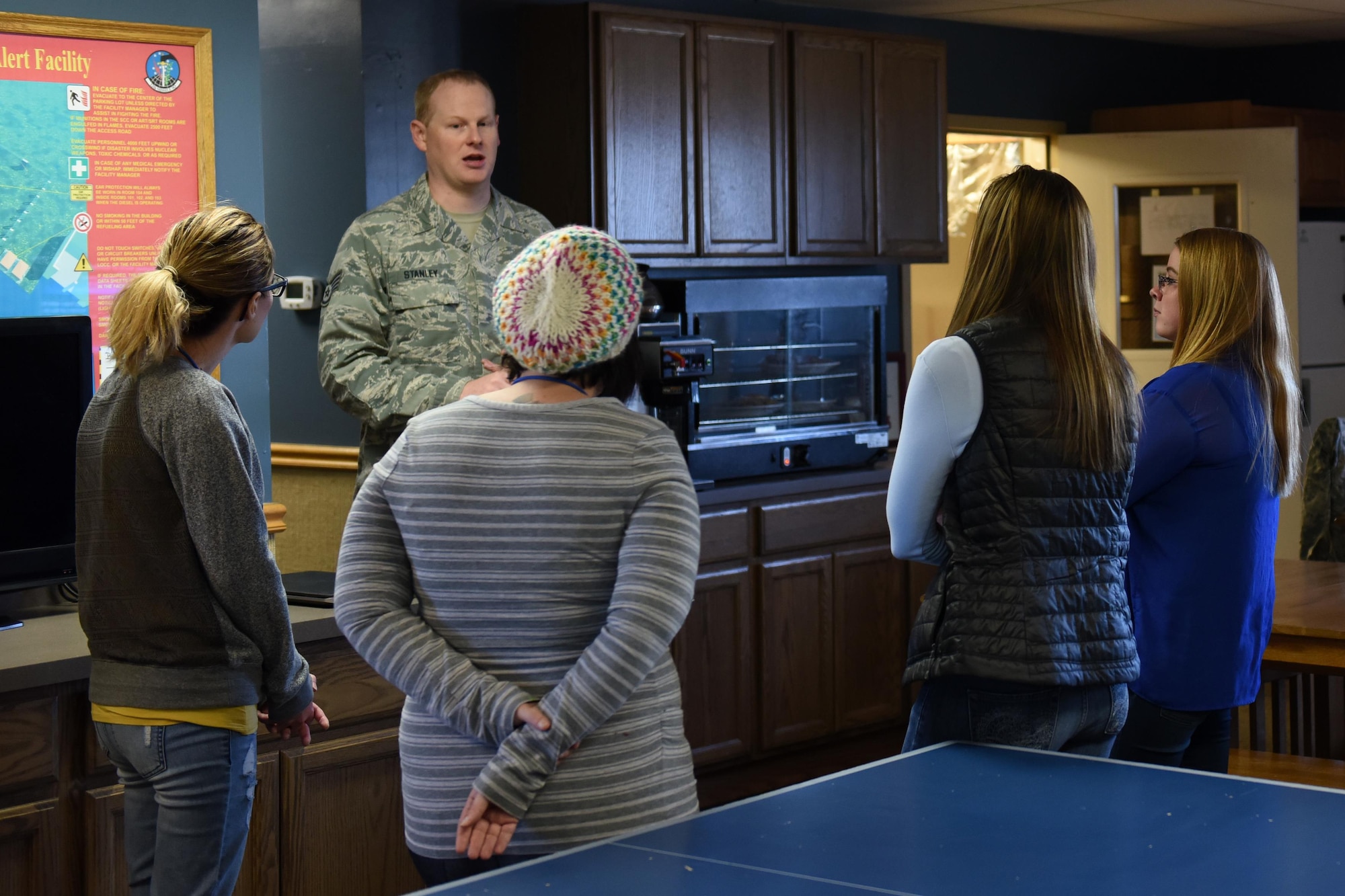 Staff Sgt. Thomas Stanley, 12th Missile Squadron facility manager, speaks with spouses during a tour at a missile alert facility Oct. 14, 2017, at Malmstrom Air Force Base, Mont. Stanley showed the spouses what day-to-day operations are at a MAF. (U.S. Air Force photo/Tech. Sgt. Caleb Pierce)