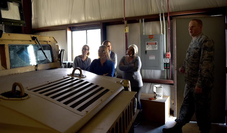 Staff Sgt. Thomas Stanley, 12th Missile Squadron facility manager, leads a tour at a missile alert facility Oct. 14, 2017, at Malmstrom Air Force Base, Mont. The tour enabled spouses to see firsthand the important role of their active-duty member. (U.S. Air Force photo/Tech. Sgt. Caleb Pierce)