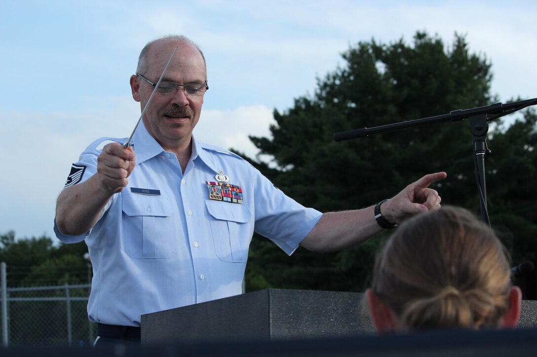 Members of the Air National Guard Band of the Northeast performed a concert at Joy Park, Akron Ohio on 26 June 2017. This was one of the band's concerts on our 2017 Summer Music Concert Series titled "Celebrating Great American Cities".  Pictured is assistant conductor Master Sergeant Richard Fitz.  (U.S. Air Force Photo/Technical Sgt. Dawn Hoffman)