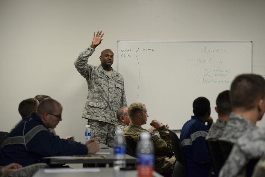 Senior Master Sgt. Damien Seals, 436th Civil Engineer Squadron readiness and emergency management flight chief, asks students a question Oct. 13, 2017, during a Wingman University class at Dover Air Force Base, Del. Seals helped teach a class titled, “I’m Tired,” which focused on managing priorities to fulfil goals and maximize resilience without getting burned out. (U.S. Air Force photo by Staff Sgt. Aaron J. Jenne)