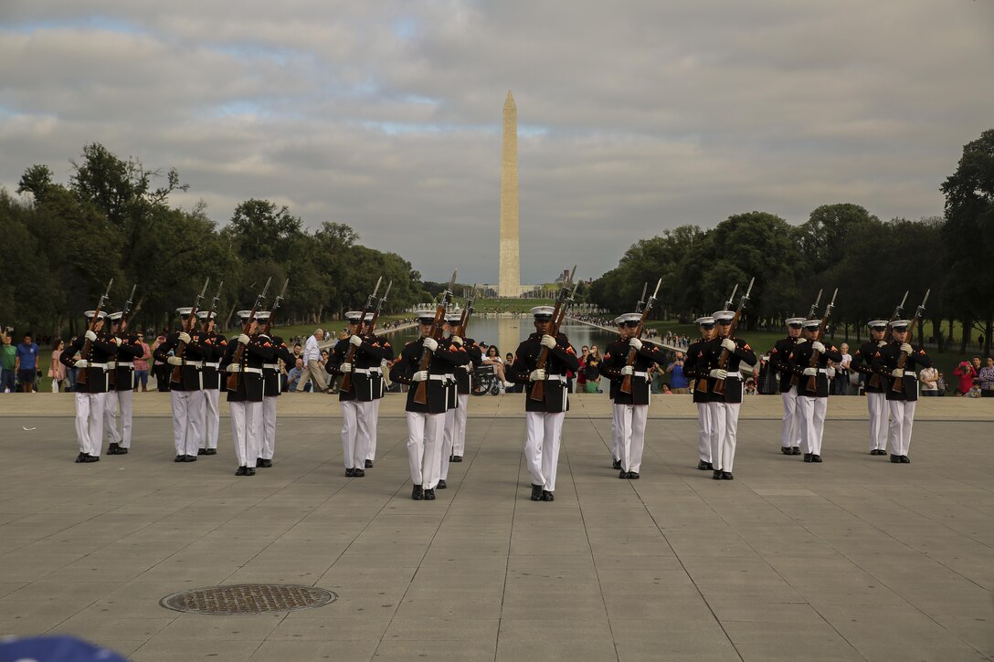 Marines with the U.S. Marine Corps Silent Drill Platoon execute precise drill movements as they perform for veterans with Old Glory Flight Northeast Tennessee, at the Lincoln Memorial, Washington D.C., Oct. 14, 2017. Old Glory Honor Flight is dedicated to transporting local WWII and Korean War veterans to visit memorials built to honor those service members who fought for our country. (Official Marine Corps photo by Lance Cpl. Damon Mclean/Released)