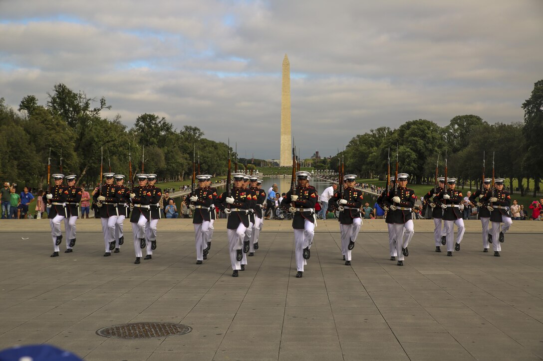 Marines with the U.S. Marine Corps Silent Drill Platoon execute precise drill movements as they perform for veterans with Old Glory Flight Northeast Tennessee, at the Lincoln Memorial, Washington D.C., Oct. 14, 2017. Old Glory Honor Flight is dedicated to transporting local WWII and Korean War veterans to visit memorials built to honor those service members who fought for our country. (Official Marine Corps photo by Lance Cpl. Damon Mclean/Released)