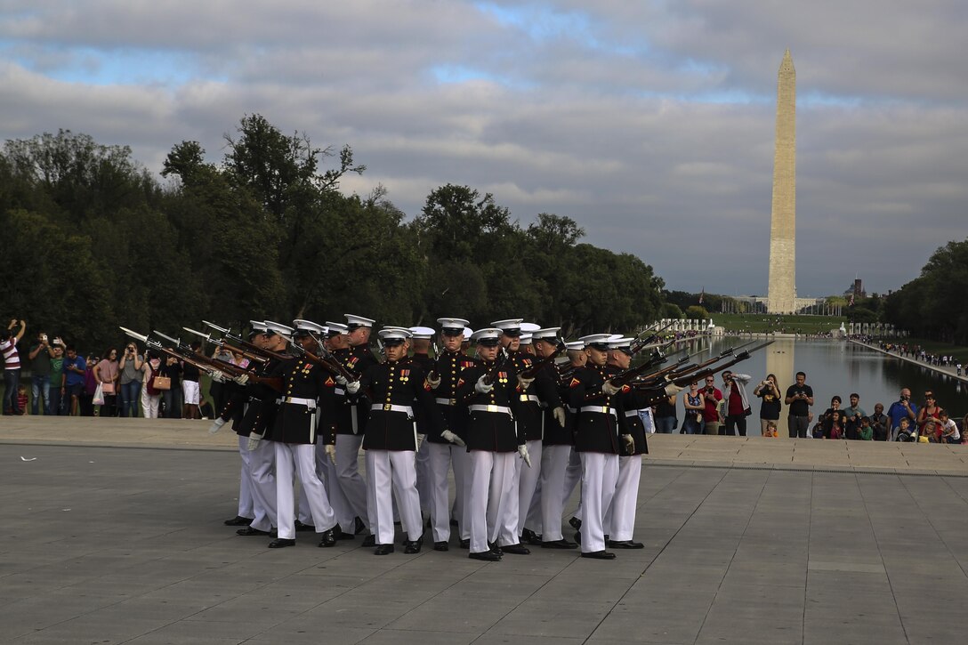 Marines with the U.S. Marine Corps Silent Drill Platoon execute their “bursting bomb” sequence during their performance for veterans with Old Glory Flight Northeast Tennessee, at the Lincoln Memorial, Washington D.C., Oct. 14, 2017. Old Glory Honor Flight is dedicated to transporting local WWII and Korean War veterans to visit memorials built to honor those service members who fought for our country. (Official Marine Corps photo by Lance Cpl. Damon Mclean/Released)