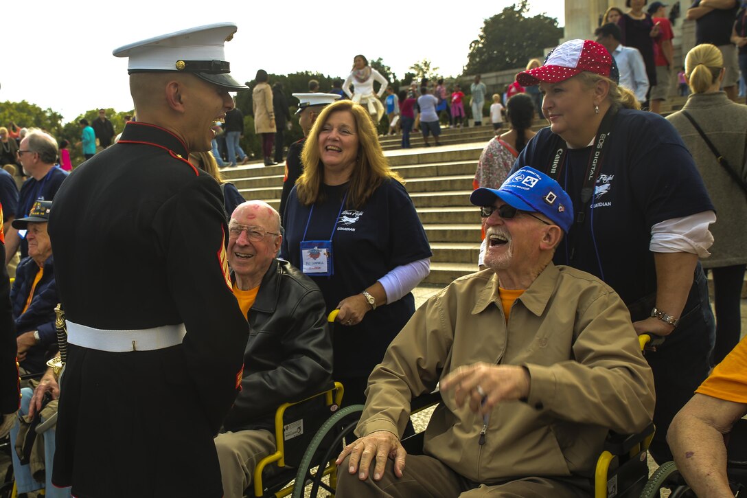 Staff Sergeant Said Lemarhi, platoon sergeant, U.S. Marine Corps Silent Drill Platoon, meets and greets veterans with Old Glory Honor Flight Northeast Tennessee, after the performance at the Lincoln Memorial, Washington D.C., Oct.  14, 2017. Old Glory Honor Flight is dedicated to transporting local WWII and Korean War veterans to visit memorials built to honor those service members who fought for our country. (Official Marine Corps photo by Lance Cpl. Damon Mclean/Released)