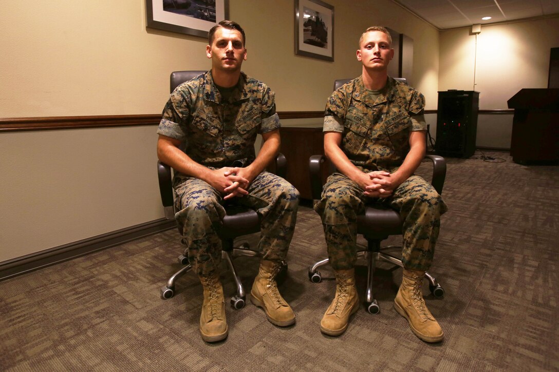 Two Marines pose for a photo.