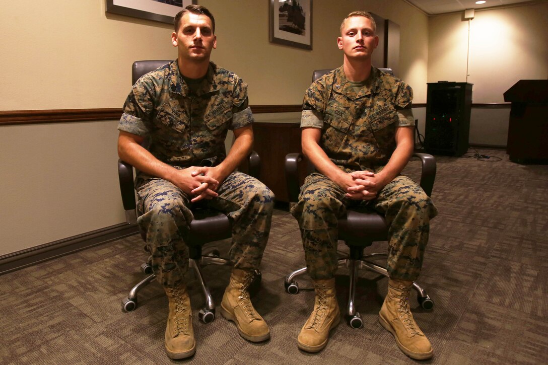Two Marines pose for a photo.