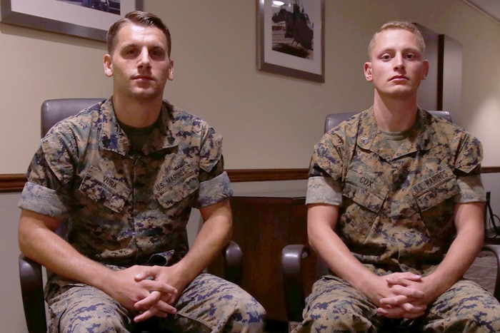 Two Marines pose for a photo.