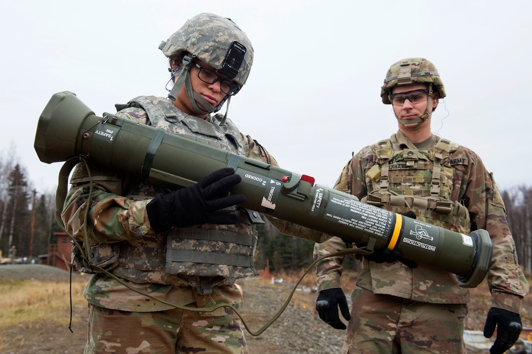 A soldier prepares a M136E1 AT4-CS light anti-armor rocket launcher during live-fire training.