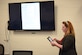 Tanya Davis, 312th Training Squadron chief of training development, demonstrates how the Fire MILE (Mobile Interaction Learning Environment) can benefit from the AirPlay feature of an iPad at the Louis F. Garland Department of Defense Fire Academy on Goodfellow Air Force Base, Texas Oct. 13, 2017. With AirPlay the trainees and instructors could share with the class any e-book, application, or training video with ease by simply displaying their iPad onto a television screen. (U.S. Air Force phot by Airman 1st Class Zachary Chapman/Released)