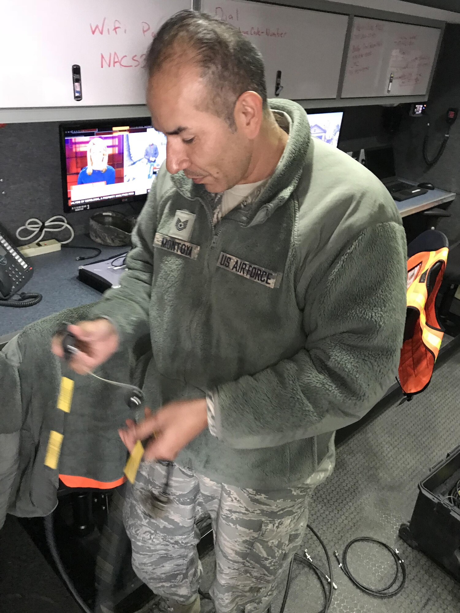 California Air National Guard Tech. Sgt. Javier Montoya sets up a flyaway kit Oct. 11, 2017, to provide satellite internet service inside a Mobile Emergency Operations Center (MEOC) from the 163d Attack Wing at March Air Reserve Base, to evacuees at Napa Valley College in Napa, California. The MEOC provided wireless internet access and a cell phone network for victims of the Northern California fires who took up shelter in the college gymnasium. (U.S. Air National Guard photo by Staff Sgt. Tyler Crumpton)