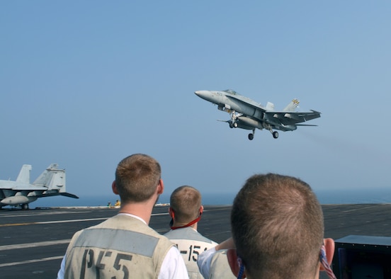 An F/A-18C Super Hornet approaches a flight deck for landing, Sept. 15, 2017, aboard the USS Nimitz. F/A-18C Super Hornet pilots with the strike group conduct maritime security operations to reassure allies and partners, preserve freedom of navigation, and maintain the free flow of commerce. (U.S. Air Force courtesy photo by Lt. Col. Alex)