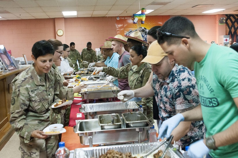 Soldiers dish up traditional Hispanic foods.