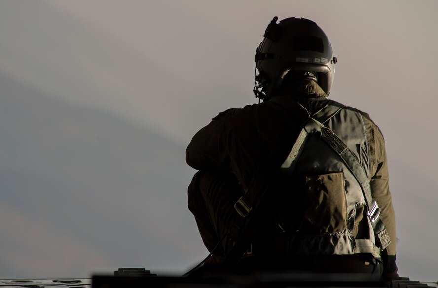 U.S. Air Force Tech. Sgt. Duane C. Jensen III, 37th Airlift Wing loadmaster, sits on the open ramp of a C-130J Super Hercules flying near Ramstein Air Base, Germany, Oct. 17, 2017. The 37th AS flew an incentive flight for participants of the Ramstein Airman and Family Readiness Center’s Heart Link program, which provides information and networking opportunities to military spouses. (U.S. Air Force photo by Senior Airman Tryphena Mayhugh)