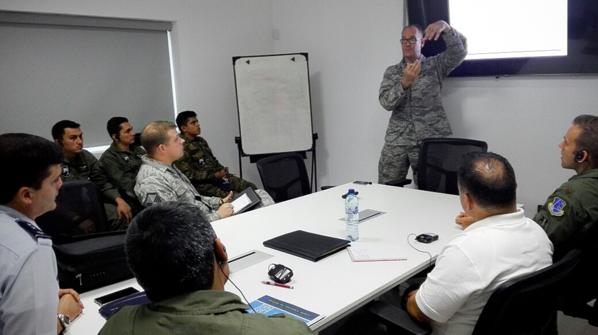 Lt. Col. Eric Corder, assistant director of operations for the 225th Air Defense Squadron, discusses air defense intercept concepts with the Guatemalan Air Force as part of the State Partnership Program Aug. 25, 2017.  The SPP links a state's National Guard with the armed forces of a partner country in a cooperative, mutually beneficial relationship by means of tailored, small footprint, high-impact security cooperation engagements that foster long-term enduring relationships with U.S. friends and allies around the world.  The SPP arose from a 1991 U.S. European Command decision to pair reserve component soldiers and airmen with the armed forces of the then newly formed nations of the Baltic Region following the collapse of the Soviet Bloc.