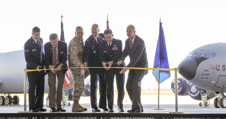 The senior personnel cut the ribbon at the ceremony marking the completion of the KC-46A Pegasus facilities completion.
