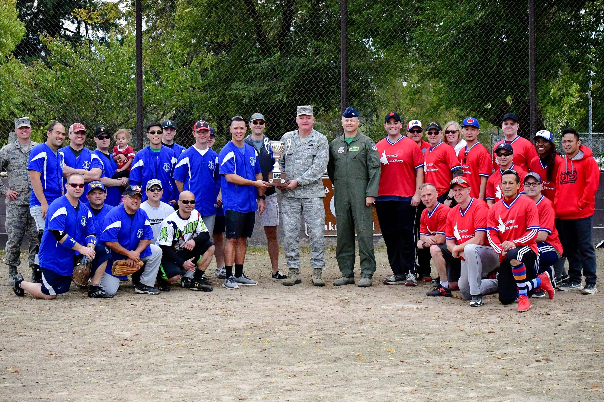 U.S. wins the Western Air Defense Sector's U.S. vs Canada Softball Challenge Cup by a final score of 25-10.  Col. William Krueger, 225th Air Defense Group commander (center), and Chief Master Sgt. Allan Lawson, 225th Air Defense Squadron senior enlisted advisor, hold the Challenge Cup trophy.