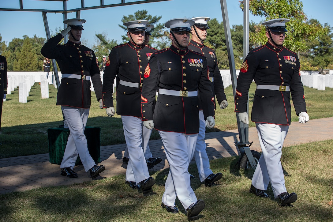 Marine Corps Body Bearers, Bravo Company, Marine Barracks Washington D.C., march from the grave site during a full honors funeral at Arlington National Cemetery, Arlington, Va., Oct. 17, 2017. Marine Barracks Washington is home to the Marines who provide support for all Marine Corps funerals and many high-ranking government officials’ funerals within the National Capitol Region. (Official U.S. Marine Corps photo by Cpl. Robert Knapp/Released)