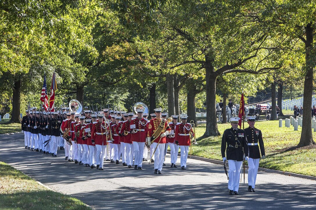 Marines with Marine Barracks Washington D.C. march at the front of a procession during a full honors funeral at Arlington National Cemetery, Arlington, Va., Oct. 17, 2017. Marine Barracks Washington is home to the Marines who provide support for all Marine Corps funerals and many high-ranking government officials’ funerals within the National Capitol Region. (Official U.S. Marine Corps photo by Cpl. Robert Knapp/Released)