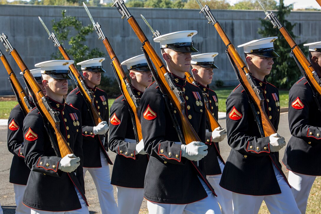 Marines with Alpha Company, Marine Barracks Washington D.C., march in company formation during a full honors funeral at Arlington National Cemetery, Arlington, Va., Oct. 17, 2017. Marine Barracks Washington is home to the Marines who provide support for all Marine Corps funerals and many high-ranking government officials’ funerals within the National Capitol Region. (Official U.S. Marine Corps photo by Cpl. Robert Knapp/Released)