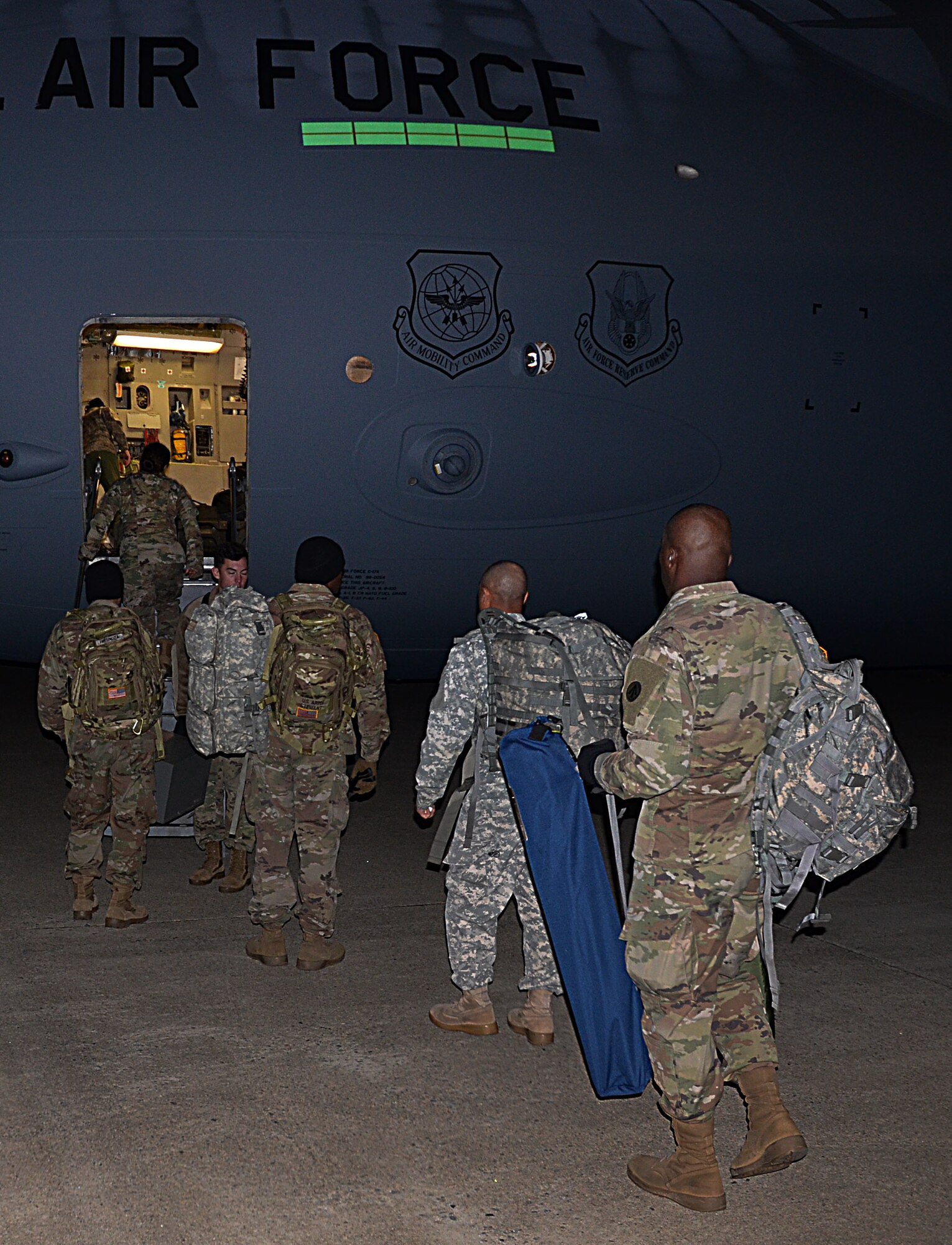 U.S. Army Soldiers assigned to the 832nd Transportation Battalion, 597th Transportation Brigade, step onto a U.S. Air Force Air Mobility Command C-17 at Joint Base Langley-Eustis, Va., Oct. 18, 2017.