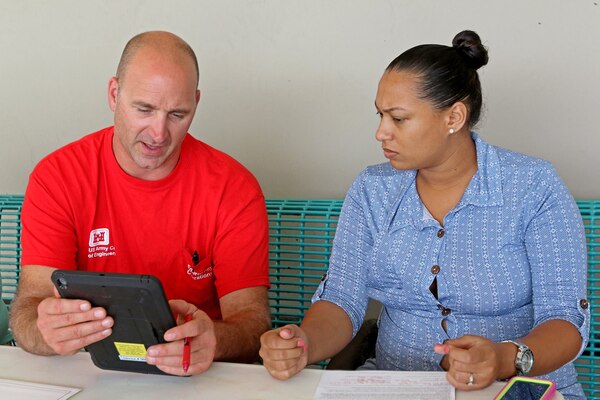 A quality insurance inspector for the U.S .Army Corps of Engineers assists during a right-of-entry registration.