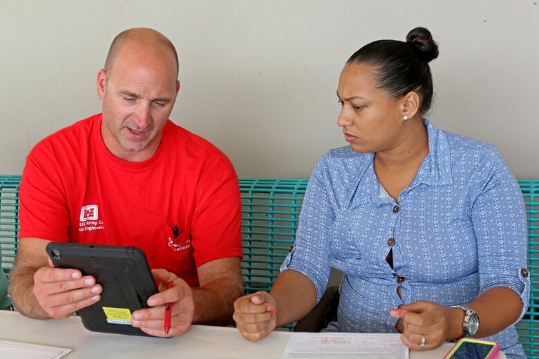 A quality insurance inspector for the U.S .Army Corps of Engineers assists during a right-of-entry registration.