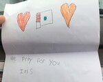 A drawing from a young girl named Iris that was included in a care package is taped to the dashboard of an Air Force pickup truck at Muniz Air National Guard Base, Puerto Rico, Oct. 16, 2017.