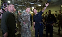 U.S. Army Lt. Gen. Jeffrey Buchanan, left, the Commander of U.S. Army North, congratulates U.S. Marines on their performance and contribution while assisting the federal and local government in hurricane relief to Puerto Rico aboard the amphibious assault ship USS Kearsarge (LHD 3) in the Caribbean Sea, Oct. 14, 2017.