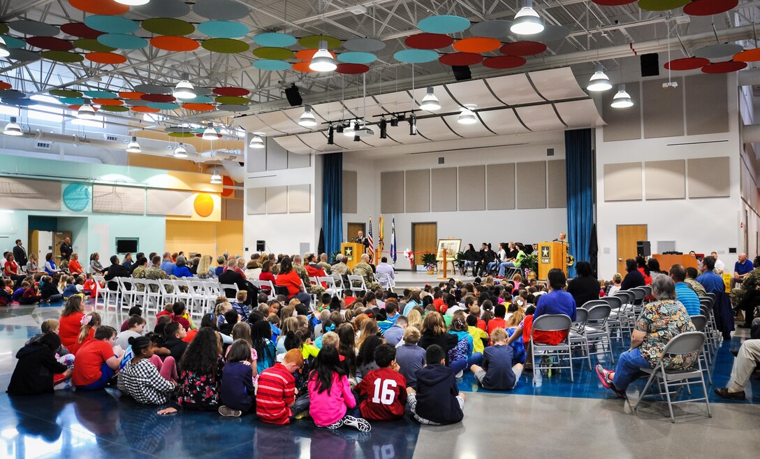 Col. Gary “Eddie” Gillon Jr., Chief of Staff, 1st Sustainment Command, Fort Knox, Kentucky addresses the audience comprised of students, faculty, and stakeholders during the Kingsolver Elementary School Ribbon Cutting Ceremony held Sept. 14, 2017.