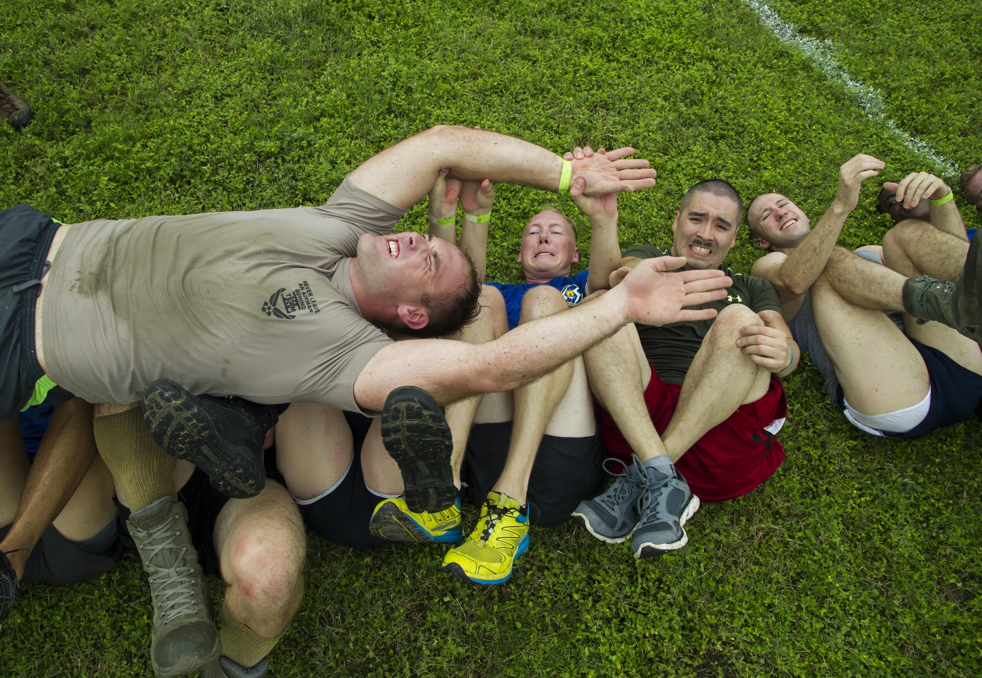 Participants in a ruck march challenge perform a crowd surfing exercise at Laughlin Air Force Base, Texas, Oct. 14, 2017.  The ruck, which started at Laughlin’s football field and continued throughout the base, was a 10-kilometer march which contained various challenges at various points along the route. (U.S. Air Force photo\Airman 1st Class Daniel Hambor)