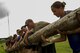 Participants in a ruck march challenge lift a log at Laughlin Air Force Base, Texas, Oct. 14, 2017.  The ruck, which challenged the 23-person team at various points during the 10 kilometer march, consisted of many team cohesion challenges. (U.S. Air Force photo\Airman 1st Class Daniel Hambor)
