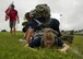 Participants in a ruck march challenge low crawl under their team at Laughlin Air Force Base, Texas, Oct. 14, 2017.  The march started when the 23-person group finished a series of team-building exercises consisting of low crawls, crowd surfing, and bear crawls.  (U.S. Air Force photo\Airman 1st Class Daniel Hambor)