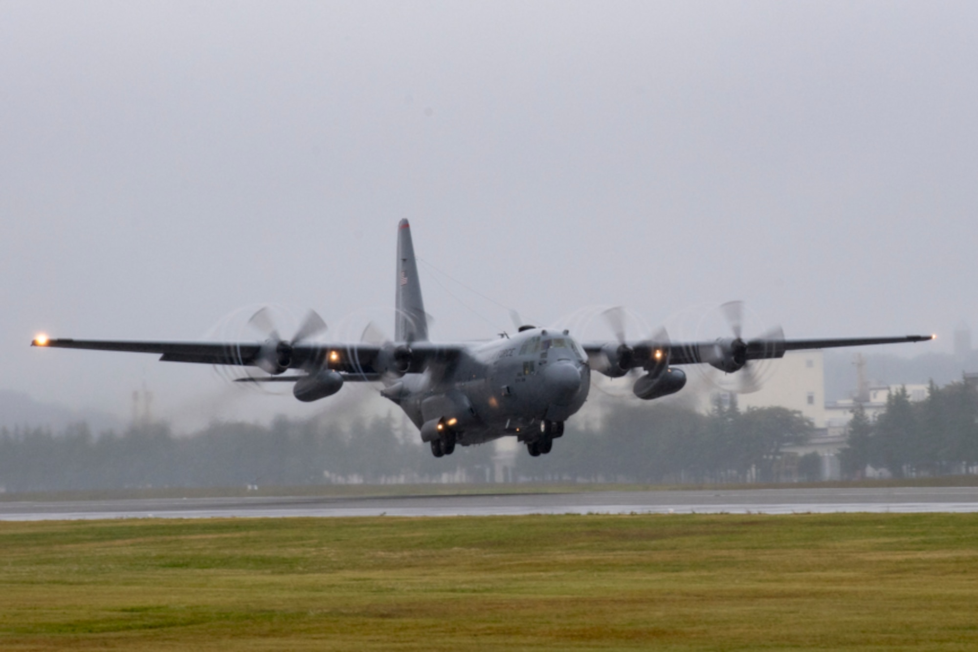 A C-130H Hercules assigned to the 36th Airlift Squadron leaves propeller tip vortices in tis wake as it takes off from Yokota Air Base, Japan, Oct. 16, 2017.