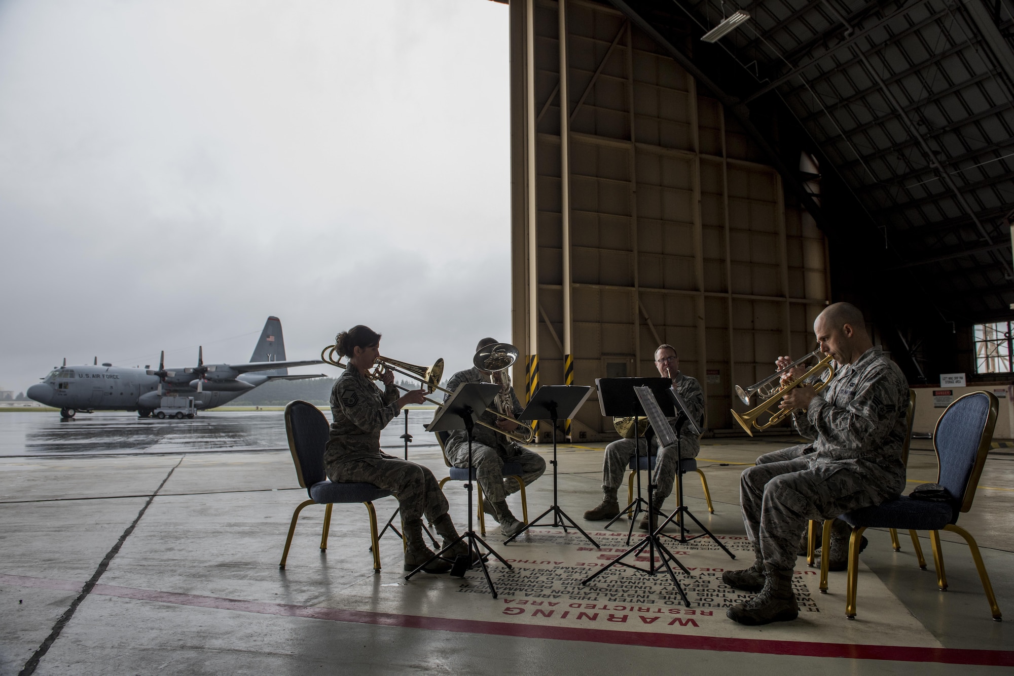 Members of the U.S. Air Force band of Pacific-Asia perform prior to the C-130H farewell ceremony at Yokota Air Base, Japan, Oct. 16, 2017.