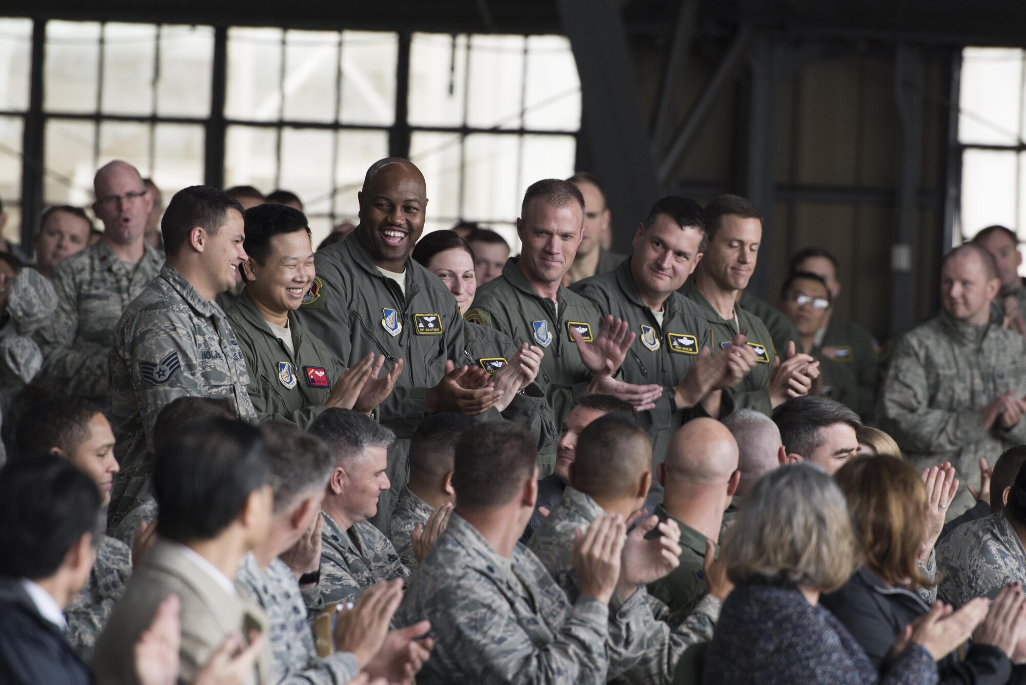 Members from the 374th Aircraft Maintenance Squadron applauds an air crew during the official C-130H Hercules Farewell Ceremony at Yokota Air Base, Japan, Oct. 16, 2017.