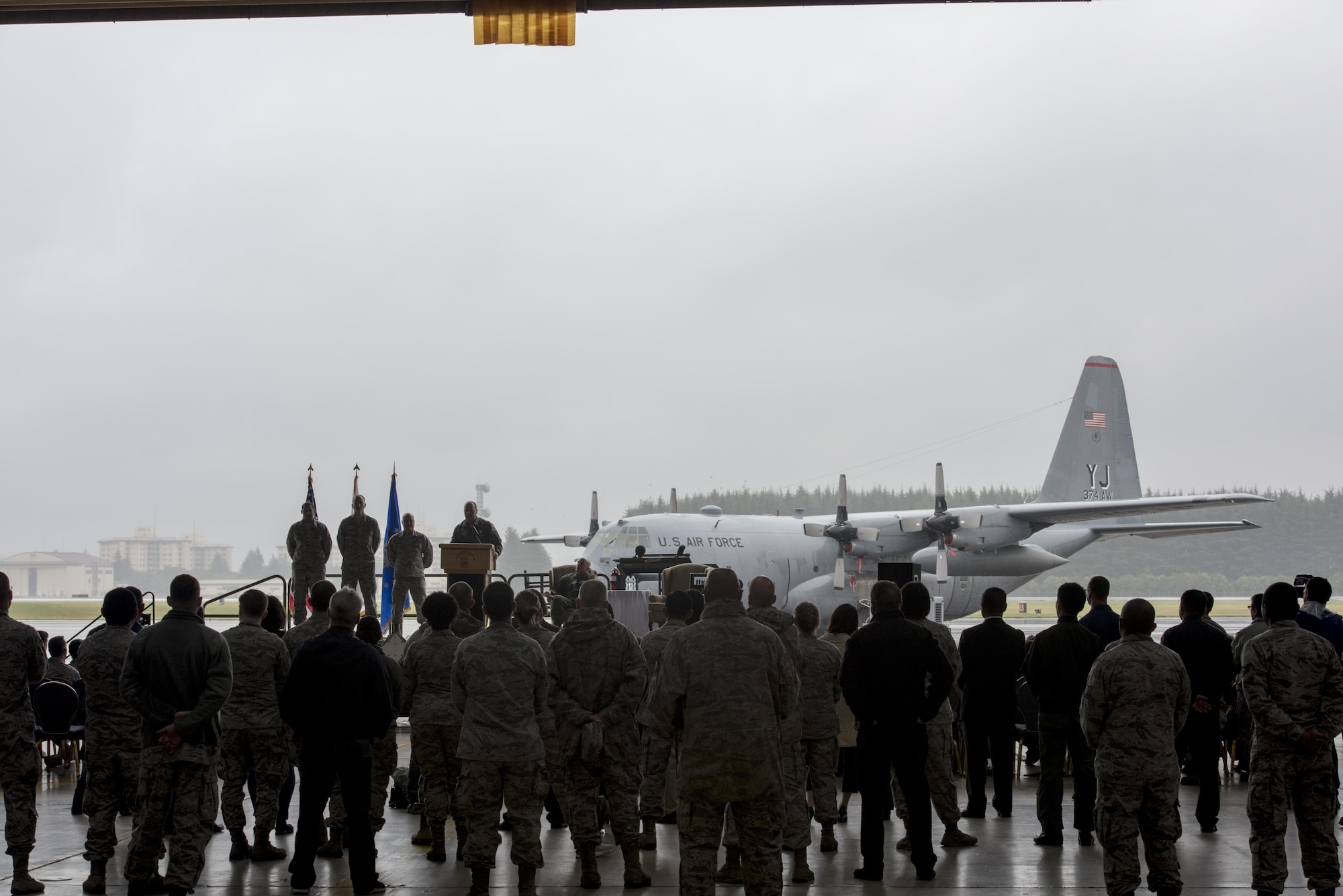 Members of Team Yokota and invited Japanese guests gather in Hangar 15 during the official C-130H Hercules Farewell Ceremony at Yokota Air Base, Japan, Oct. 16, 2017.