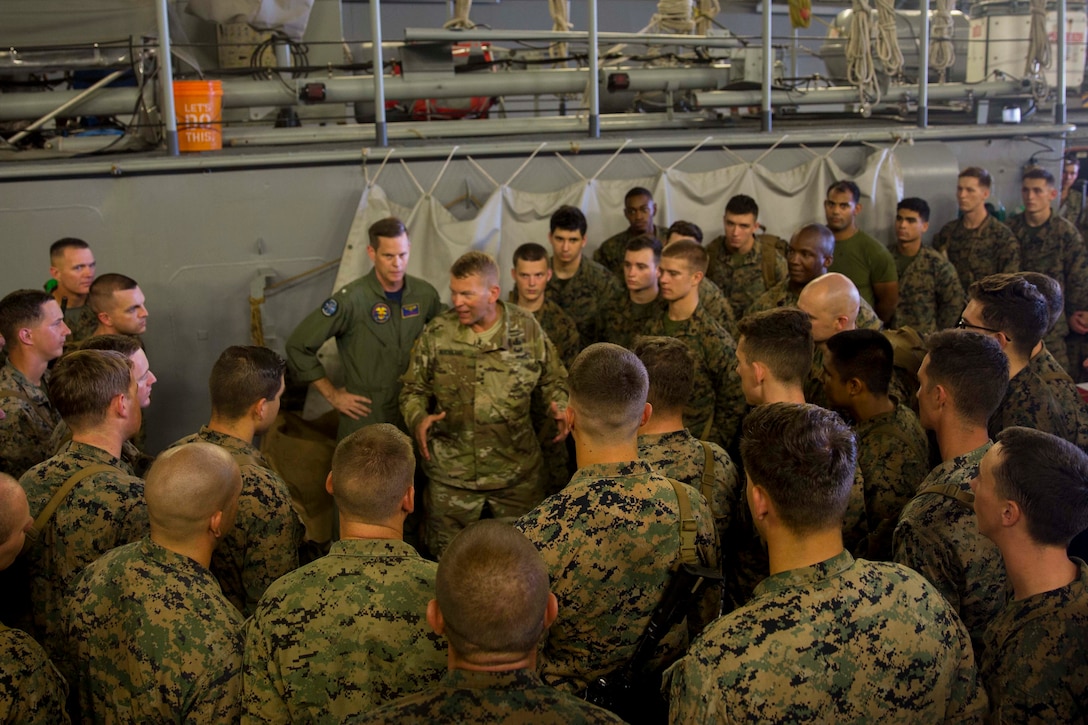 U.S. Army Lt. Gen. Jeffrey Buchanan, center, the Commander of U.S. Army North, speaks to U.S. Marines with the 26th Marine Expeditionary Unit (MEU) about their performance and contribution while assisting the federal and local government in hurricane relief to Puerto Rico aboard the amphibious assault ship USS Kearsarge ( LHD 3) in the Caribbean Sea, Oct. 14, 2017.