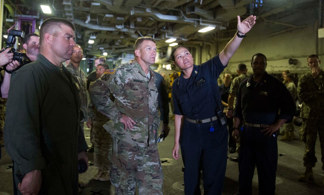 U.S. Army Lt. Gen. Jeffrey Buchanan, center, the Commander of U.S. Army North, speaks to Marines and Sailors about their experiences providing hurricane relief to Puerto Rico aboard the amphibious assault ship USS Kearsarge (LHD 3) in the Caribbean Sea, Oct. 14, 2017. The Department of Defense is supporting Federal Emergency Management Agency, the lead federal agency, in helping those affected by Hurricane Maria to minimize suffering and is one component of the overall whole-of-government response effort. (U.S. Marine Corps photo by Cpl. Juan A. Soto-Delgado)