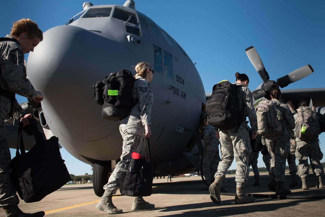 U.S. Air Force Airmen assigned to the 633rd Medical Group deploy from Joint Base Langley-Eustis, Va., Oct. 18, 2017. Approximately 87 Langley Air Force Base Airmen deployed as a global response force to provide expeditionary medical care to Puerto Rico residents. (U.S. Air Force photo by Tech. Sgt. Natasha Stannard)