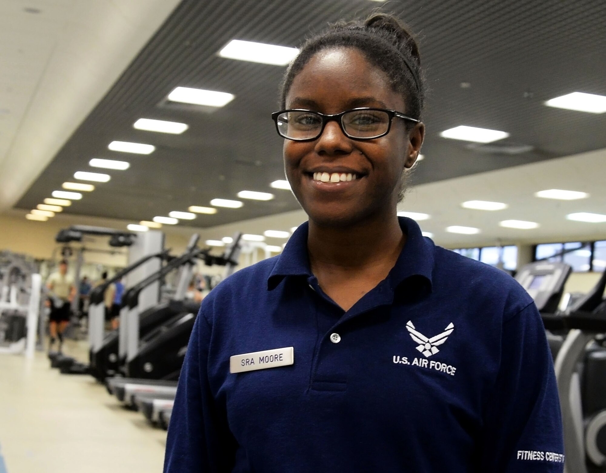 U.S. Air Force Senior Airman Asia Moore, 100th Force Support Squadron fitness specialist, stands in the Hardstand Fitness Center on RAF Mildenhall, England, Sept. 22, 2017. Moore is also pursuing a career as a DJ, and has performed at base events, private parties and at clubs in the local area. (U.S. Air Force photo by Senior Airman Justine Rho)