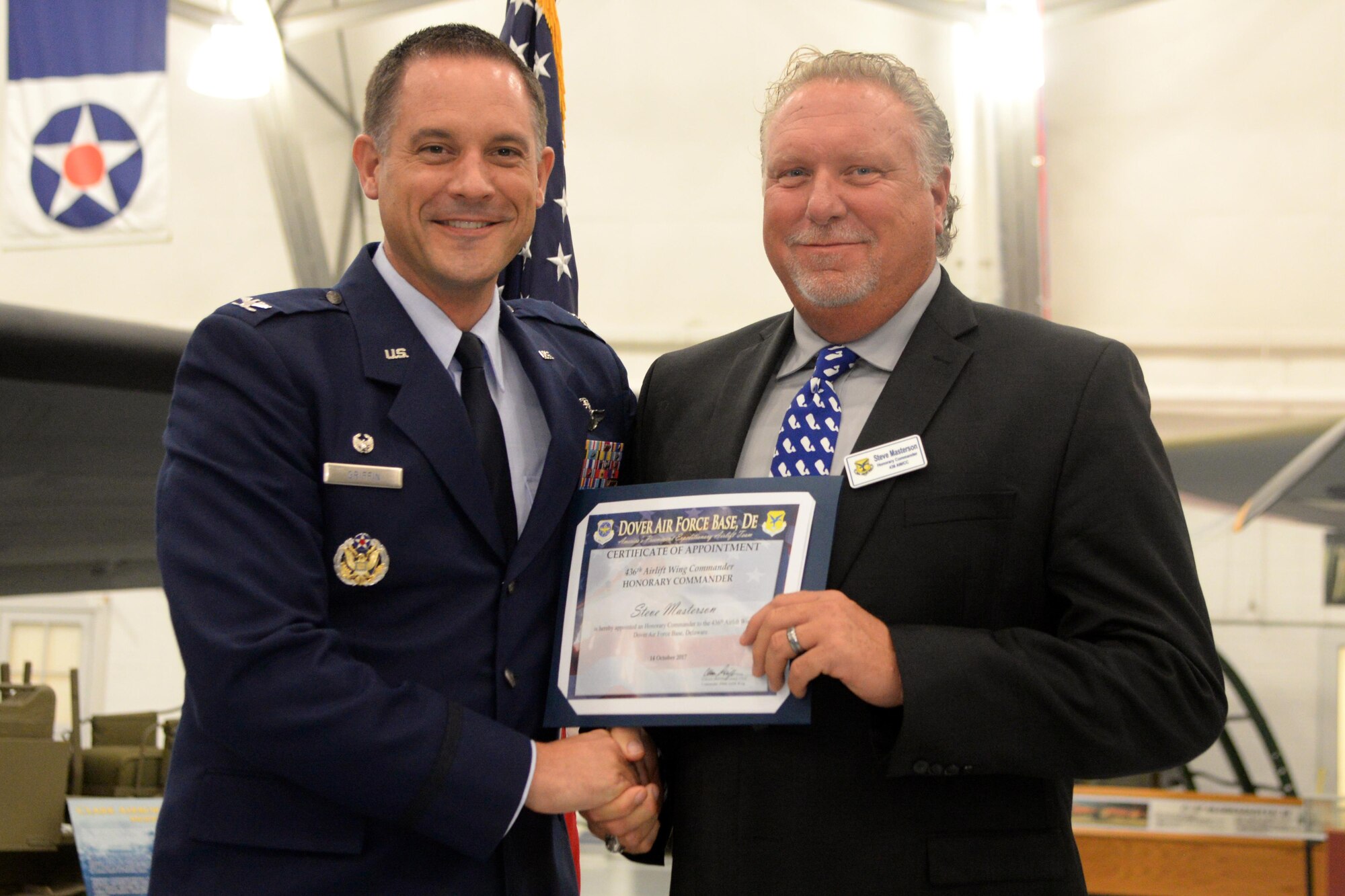 Members of Team Dover and civic leaders meet during the Honorary Commander’s Induction Ceremony at the Air Mobility Command Museum on Dover Air Force Base, Del. Oct. 14, 2017. The program was started to help members of the community understand the importance of the base’s missions by being matched with military commanders.