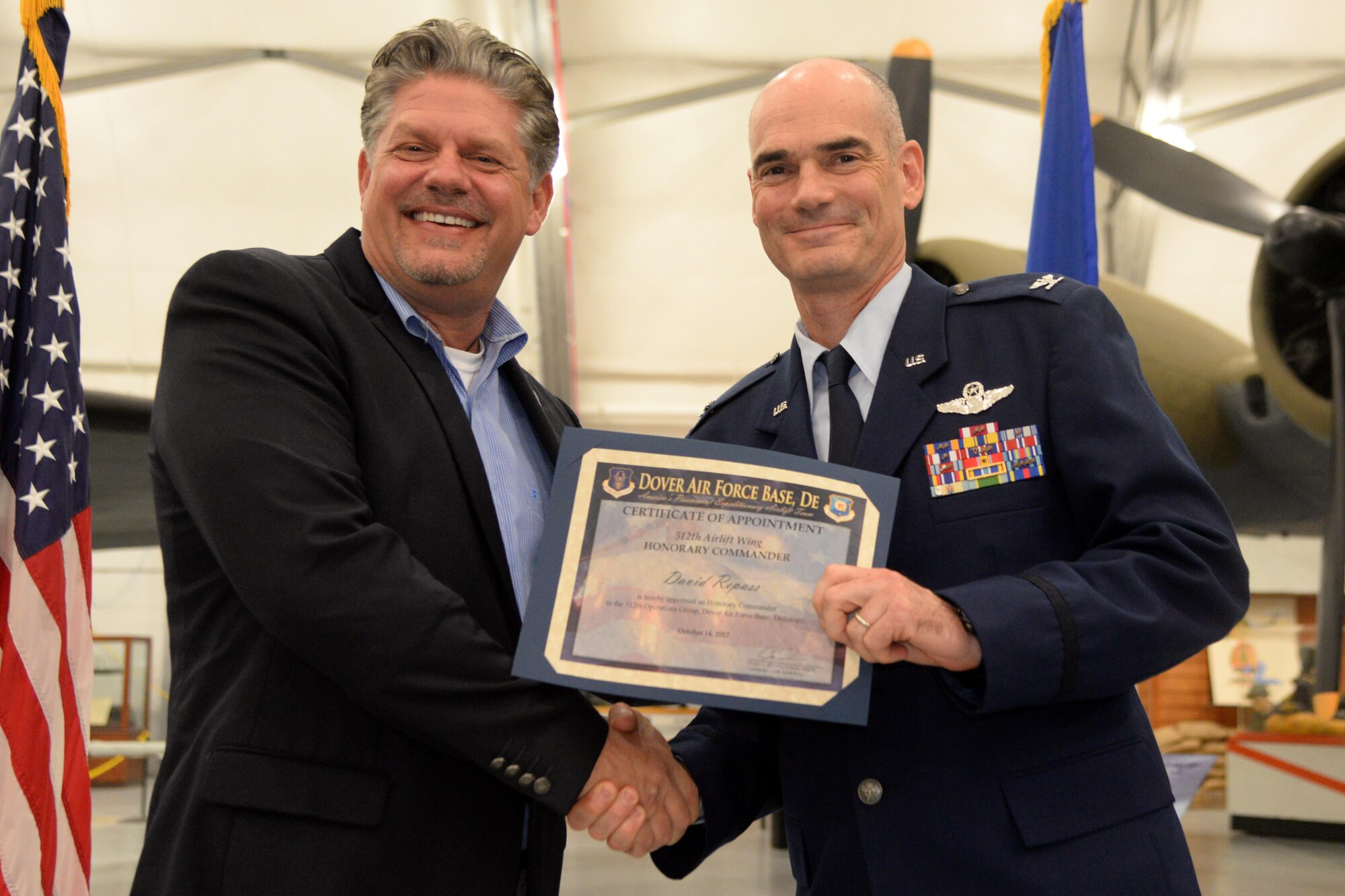Members of Team Dover and civic leaders meet during the Honorary Commander’s Induction Ceremony at the Air Mobility Command Museum on Dover Air Force Base, Del. Oct. 14, 2017. The program was started to help members of the community understand the importance of the base’s missions by being matched with military commanders.