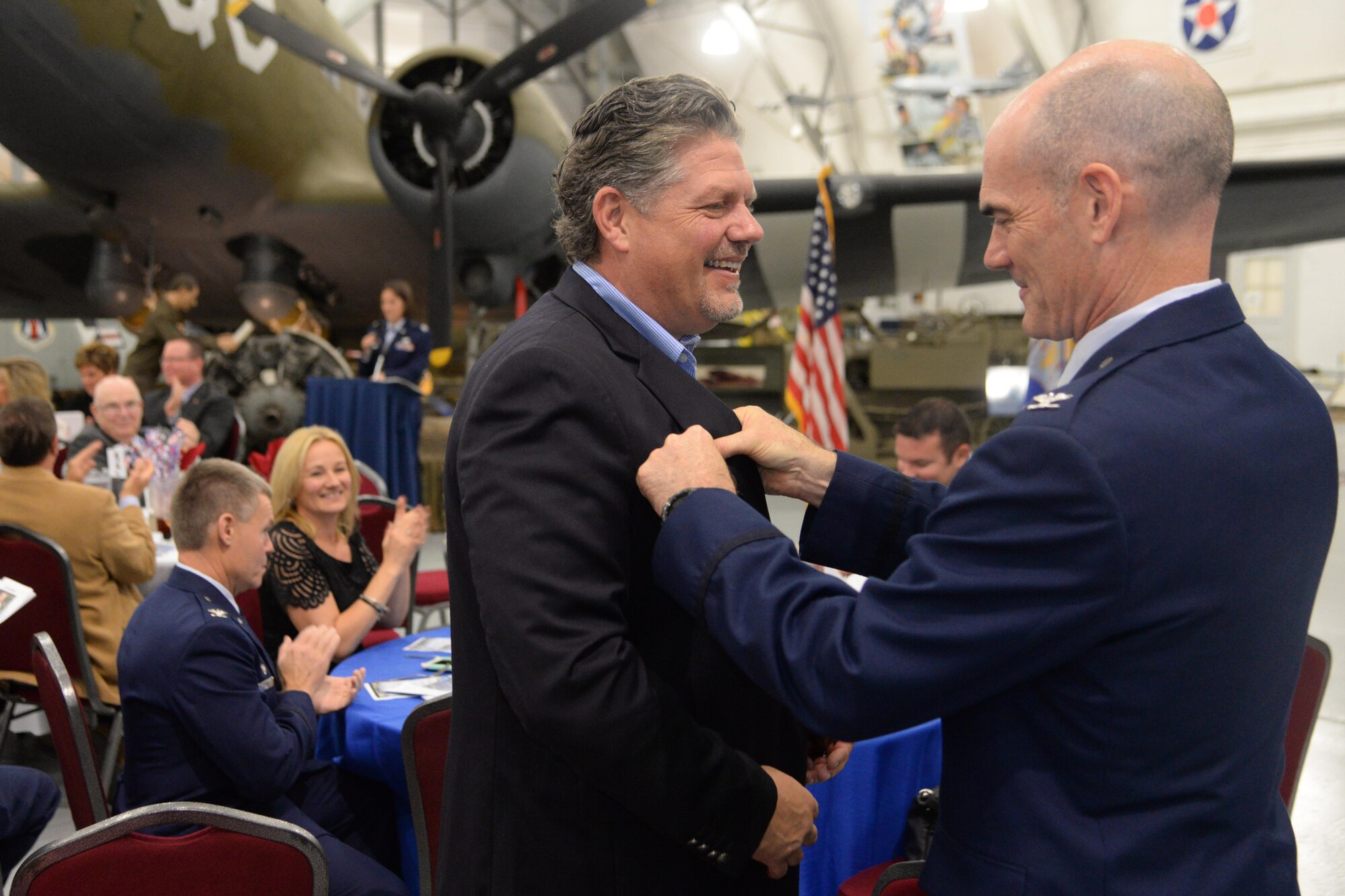 Members of Team Dover and civic leaders meet during the Honorary Commander’s Induction Ceremony at the Air Mobility Command Museum on Dover Air Force Base, Del. Oct. 14, 2017. The program was started to help members of the community understand the importance of the base’s missions by being matched with military commanders.